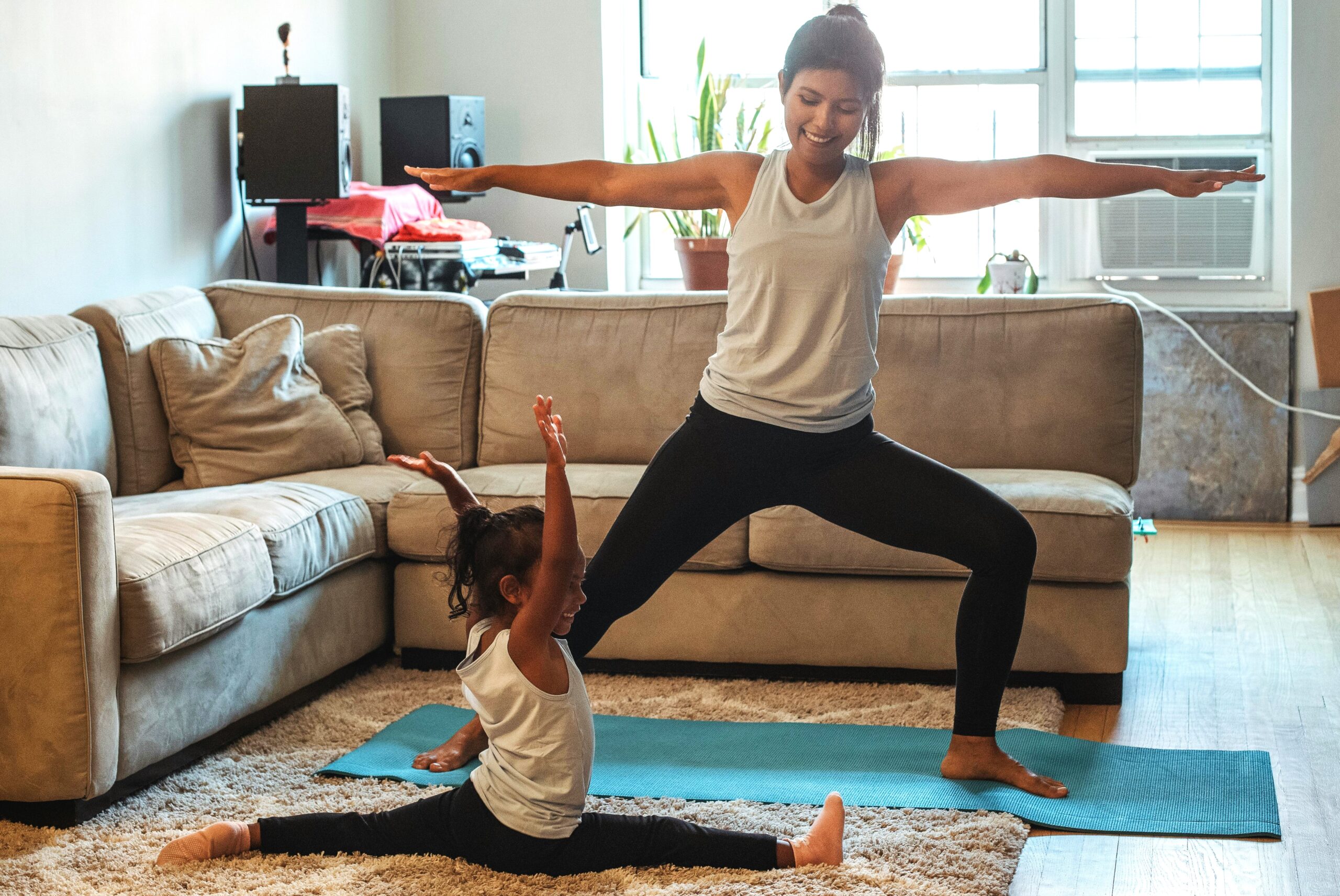 Mom and daughter in livingroom learning what to eat before and after exercise